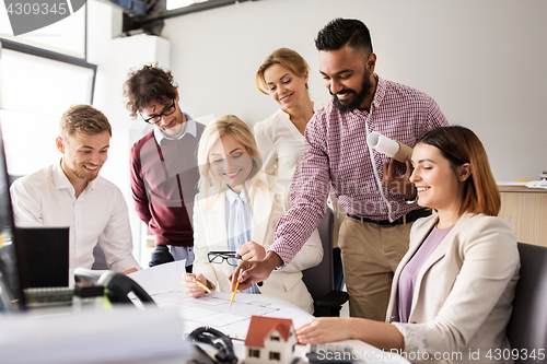 Image of business team discussing house project at office