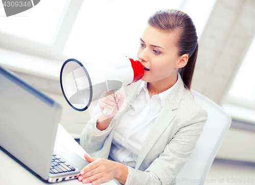 Image of strict businesswoman shouting in megaphone