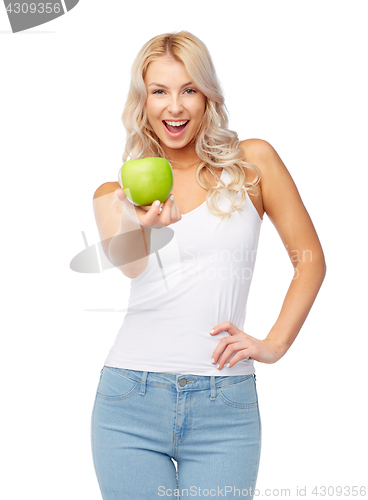Image of happy beautiful young woman with green apple