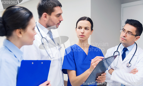 Image of group of medics with clipboards at hospital