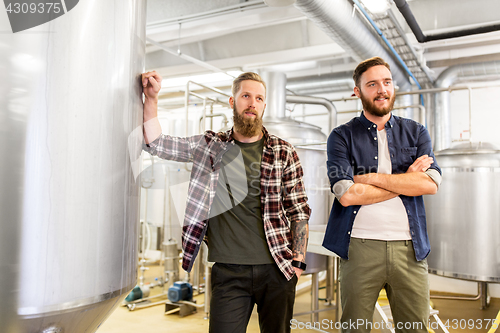 Image of men at craft brewery or beer plant