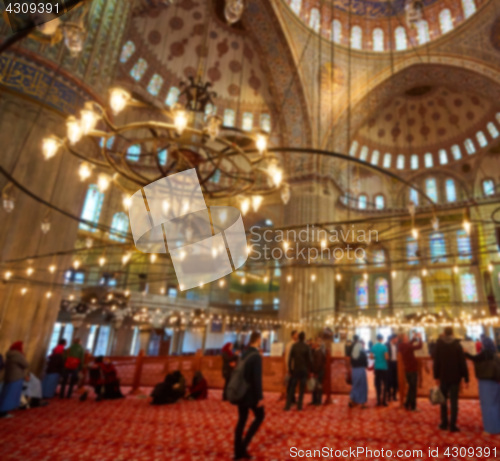 Image of blur image of Muslims praying inside Mosque