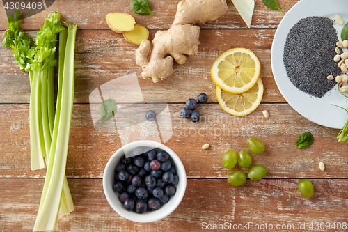 Image of fruits, berries and vegetables on wooden table