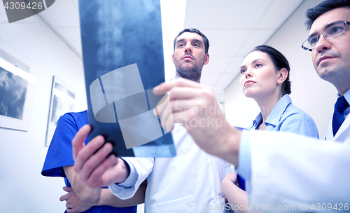 Image of group of medics with spine x-ray scan at hospital