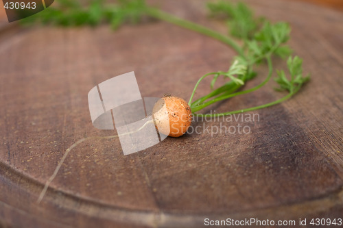 Image of baby carrot on a chopping board