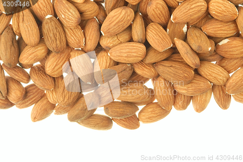 Image of Almonds scattered over white background