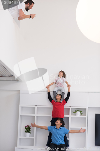 Image of young boys posing line up piggyback