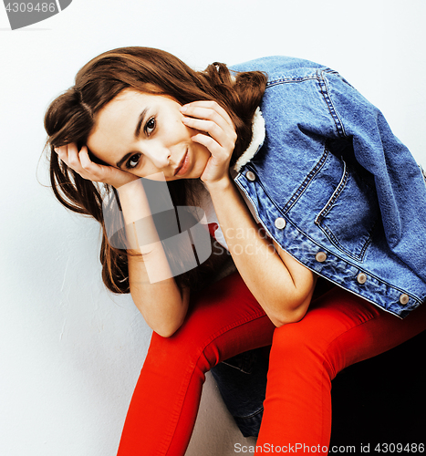 Image of young pretty teenage hipster girl posing emotional happy smiling on white background, lifestyle people concept 