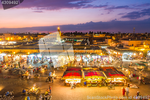 Image of Jamaa el Fna market square in sunset, Marrakesh, Morocco, north Africa.