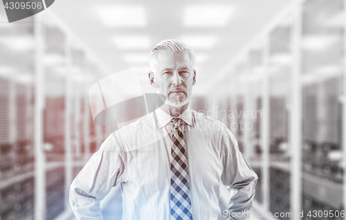 Image of Senior businessman in server room