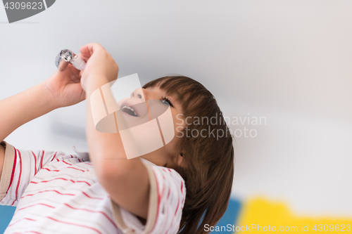 Image of kid blowing a noisemaker