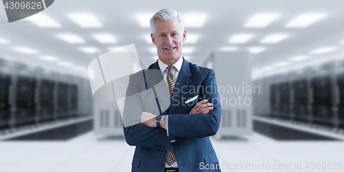 Image of Senior businessman in server room