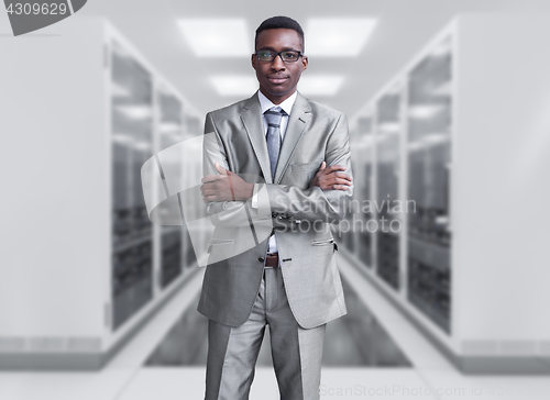 Image of Young  black man in server room