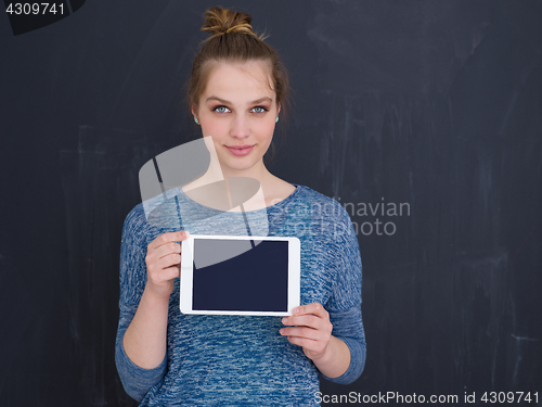 Image of woman using tablet computer isolated over gray