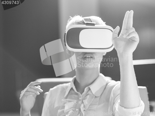 Image of Young woman using vr glasses