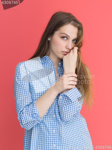 Image of woman playing with her long silky hair