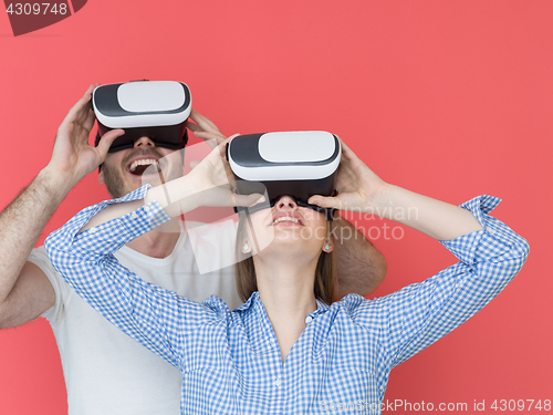 Image of happy couple using VR-headset glasses of virtual reality