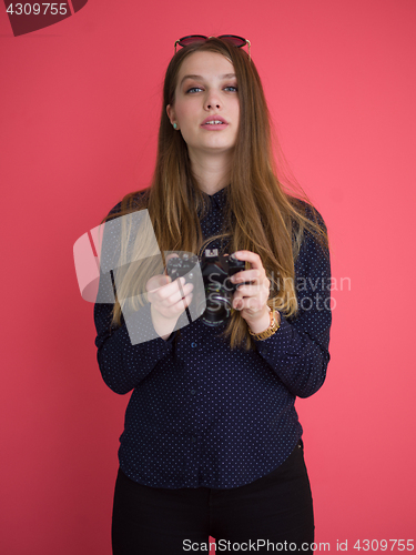 Image of girl taking photo on a retro camera