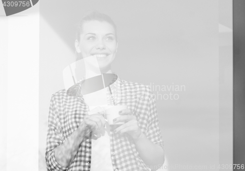 Image of Portrait of young girl smiling and drinking coffe