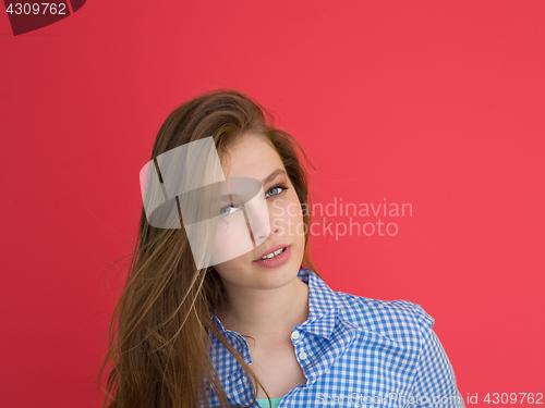 Image of woman playing with her long silky hair