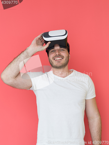 Image of young man using VR headset glasses of virtual reality