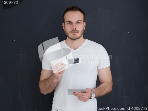 Image of man using tablet computer isolated over gray