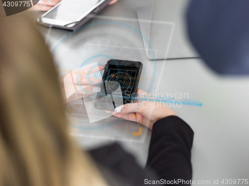 Image of Elegant Woman Using Mobile Phone in office building