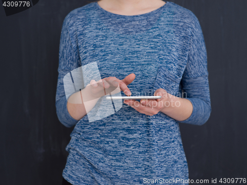 Image of woman using tablet computer isolated over gray