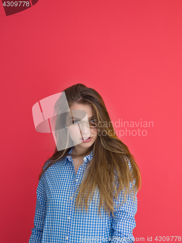 Image of woman playing with her long silky hair