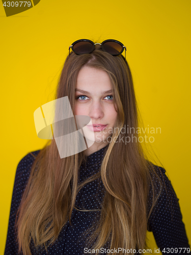 Image of young woman isolated on yellow background