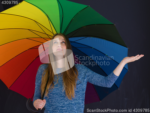 Image of handsome woman with a colorful umbrella