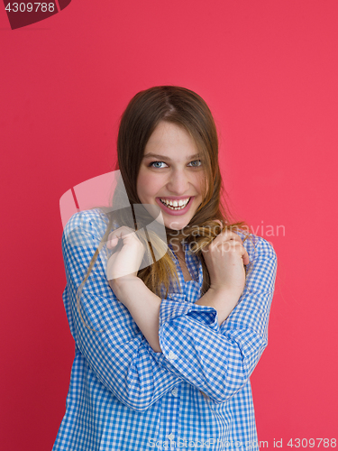 Image of woman playing with her long silky hair