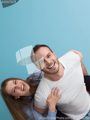 Image of young man piggybacking his girlfriend