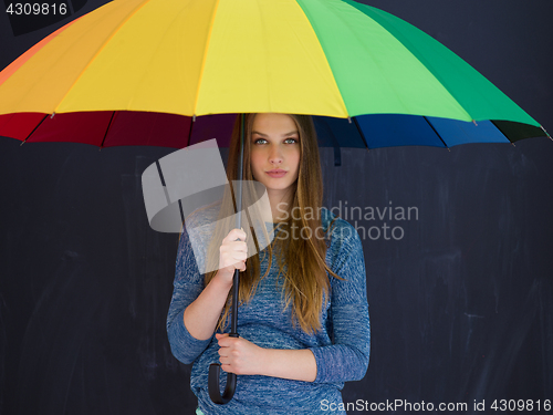 Image of handsome woman with a colorful umbrella