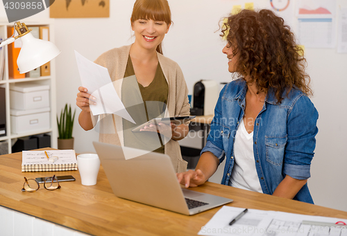 Image of Two businesswoman working together