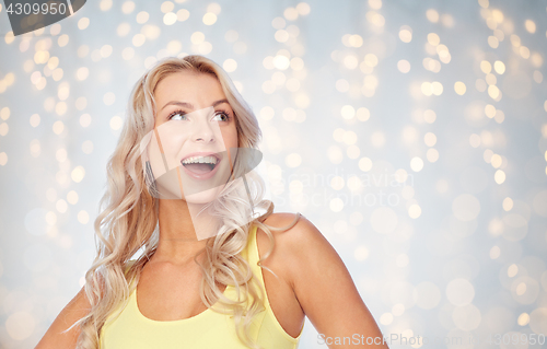 Image of happy smiling young woman with blonde hair