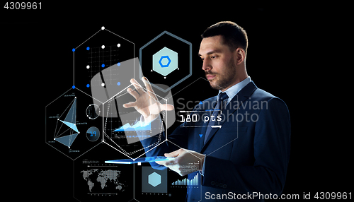 Image of businessman with tablet pc and virtual screen