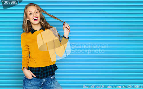 Image of happy young woman or teen girl in casual clothes