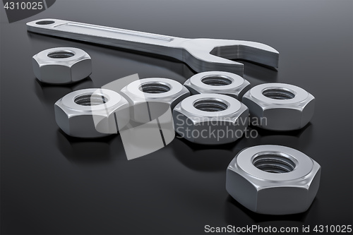 Image of a hexagon nut with a wrench