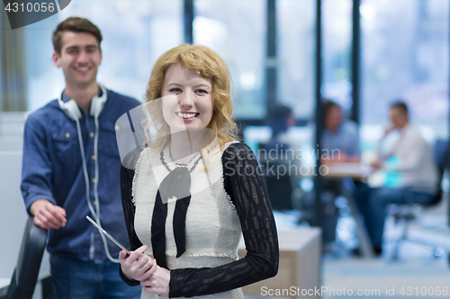 Image of Business People Working With Tablet in startup office