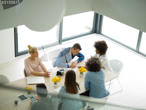 Image of Multiethnic startup Business Team At A Meeting at modern office 