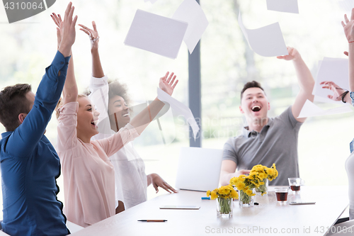 Image of multiethnic startup Group of young business people throwing docu