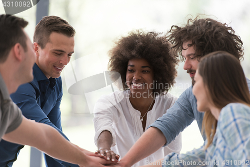 Image of multiethnic startup Group of young business people celebrating s