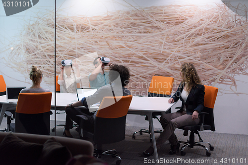 Image of startup business team using virtual reality headset