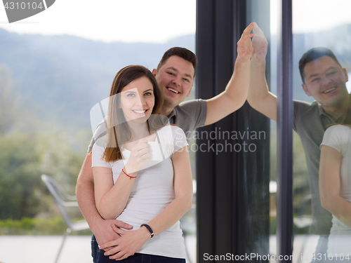 Image of young couple enjoying morning coffee