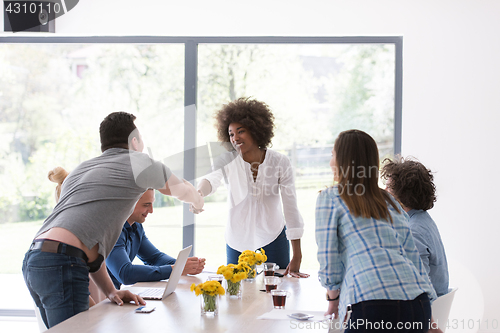 Image of multiethnic startup Group of young business people celebrating s