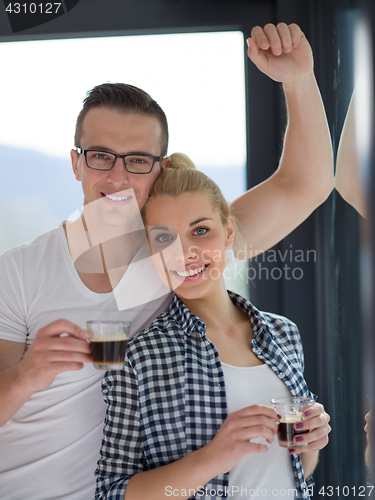 Image of young couple enjoying morning coffee