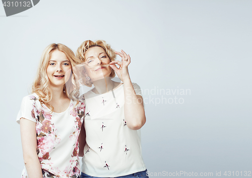Image of mother with daughter together posing happy smiling isolated on white background with copyspace, lifestyle people concept 