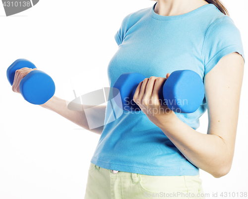 Image of young pretty brunette woman with blue dumbbell isolated cheerful smiling, part of body, diet people concept on white background