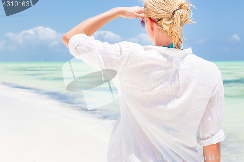 Image of Happy woman enjoying, relaxing joyfully in summer on tropical beach.